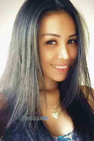 Smiling woman with long dark hair.