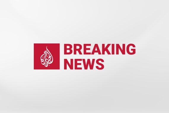 Al Jazeera "Breaking News" red banner.