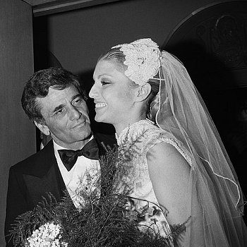 Bride and groom smiling at each other.