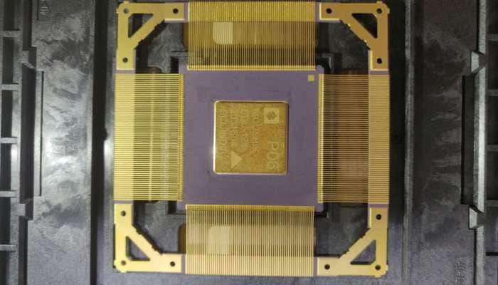 Electronic microchip with gold connectors.